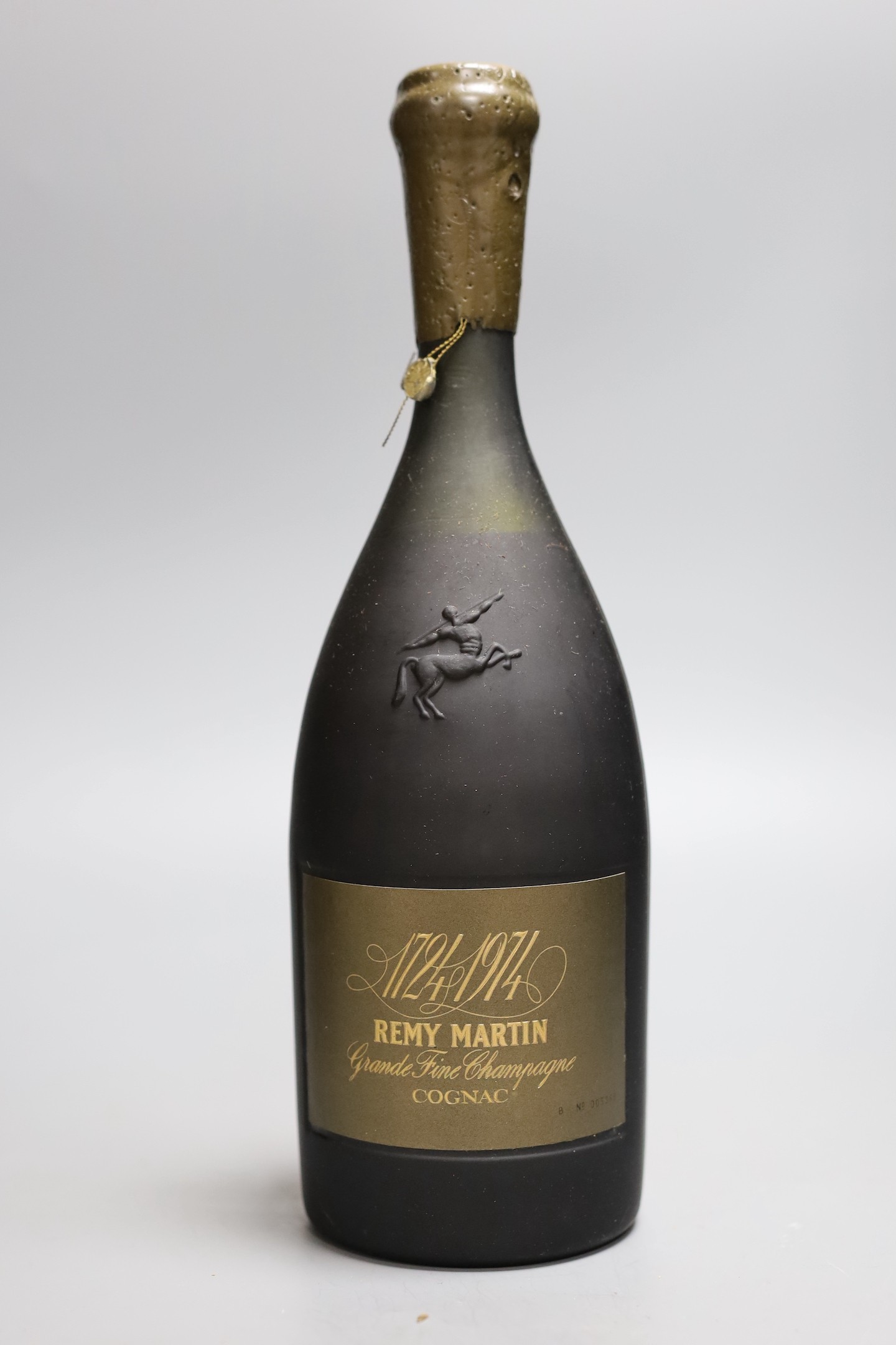 A bottle of Remy Martin 1724-1974 Grande Fine Champagne Cognac, bottle no.5368